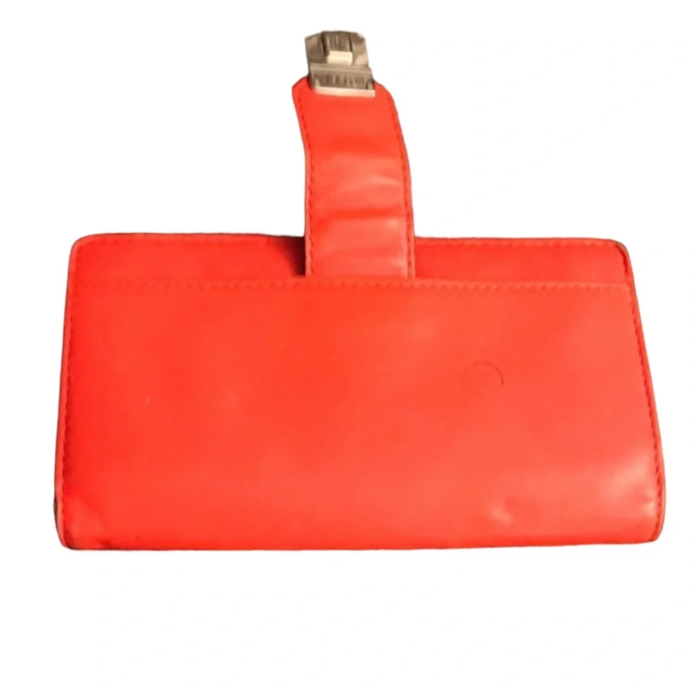 Milly wristlet orange mobile wallet front snap ,zip  lots of pockets